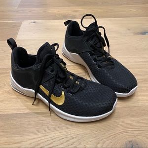 Nike black sneakers with gold accents
